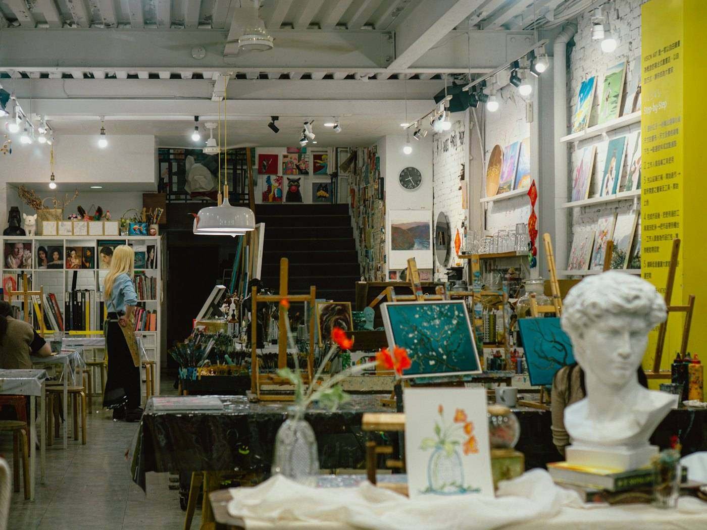 Open art and design studio with easels and works in progress